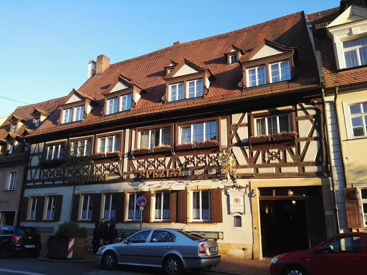 Half-timbered brewery inn with Brauerei Spezial in gold lettering across the front, on a Bamberg street