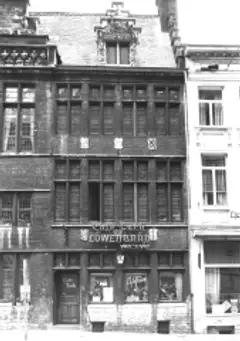 Black-and-white photograph of the late-Gothic stone front of Botermarkt 3, lettered Cafe Turk over the ground floor and on the door