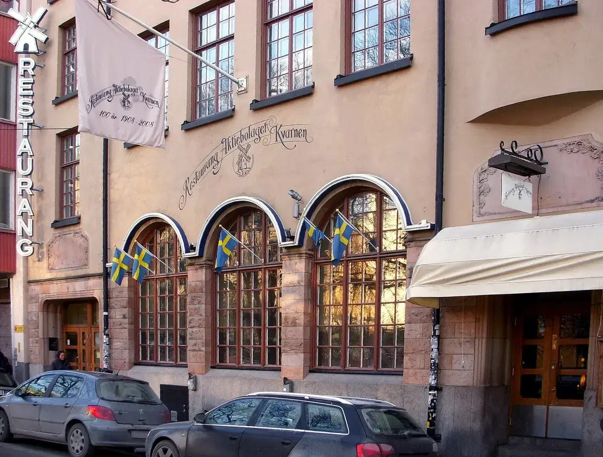Beer hall front with Restaurang Aktiebolaget Kvarnen painted above three arched windows