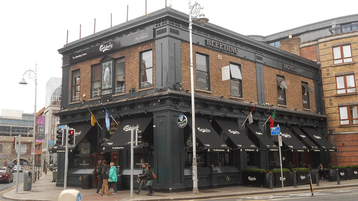 The black-painted corner of the Bleeding Horse in Dublin, its name in gold on the brickwork