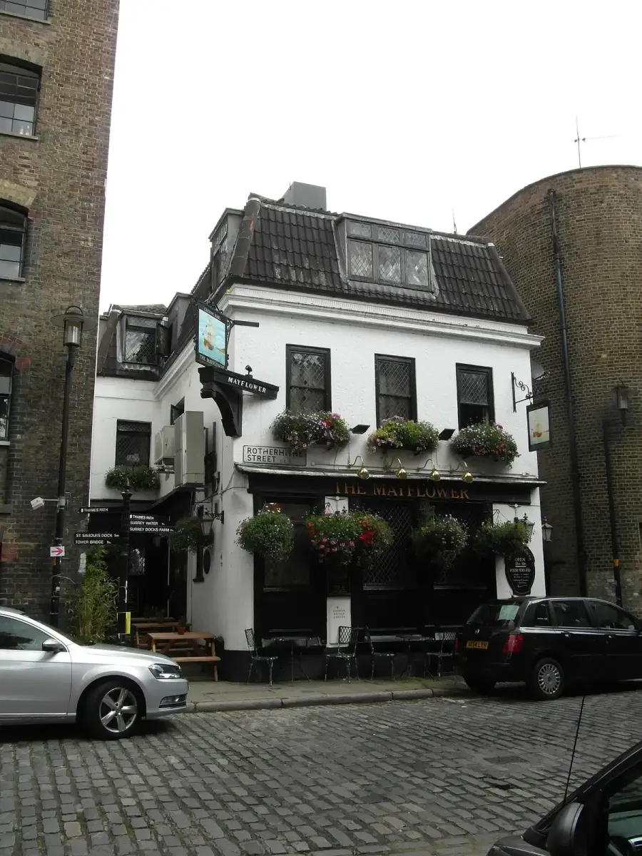 The Mayflower at Rotherhithe, its name in gold on the black front, hanging baskets either side
